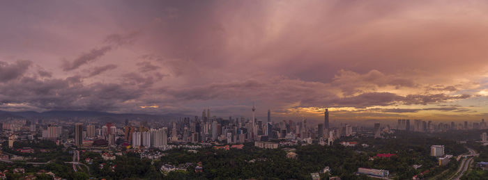 High angle view of buildings against sky during sunset