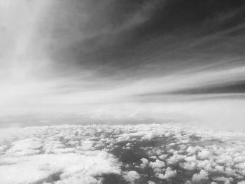 Aerial view of landscape against cloudy sky