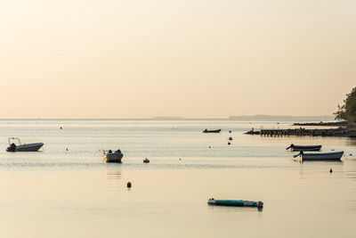 Scenic view of sea against clear sky during sunset