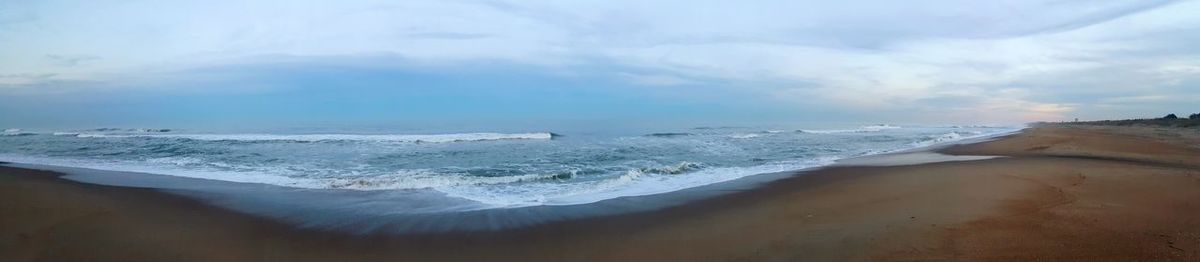 Panoramic view of beach against sky