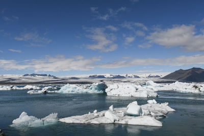 Scenic view of sea against sky during winter