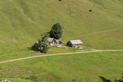 High angle view of houses on field by house