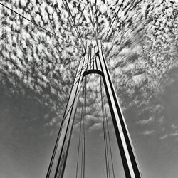 Low angle view of suspension bridge against sky