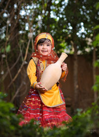 A two-year-old girl wearing a bakhtiari ethnic dress 