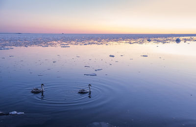 Scenic view of sea against sky at sunset