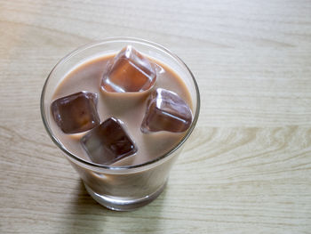 Close-up of coffee in glass on table