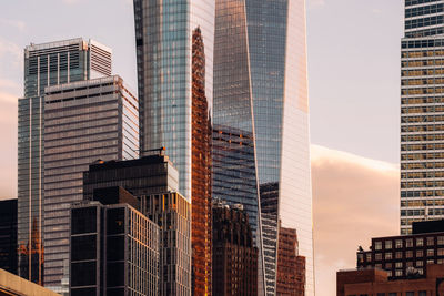 Low angle view of modern buildings against sky