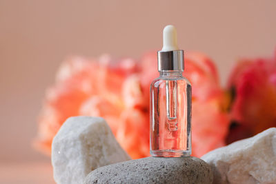 Close-up of bottles against white background