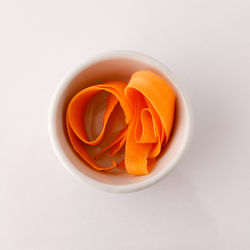 High angle view of orange rose in bowl