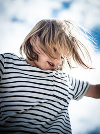 Portrait of boy against sky