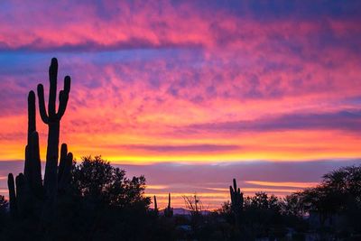 Scenic view of dramatic sky at sunset