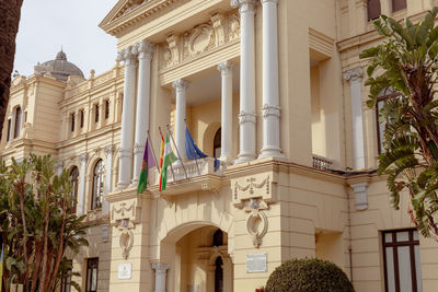 Malaga, spain- 26-01-2024 ornate entrance of the city hall of malaga with european flags