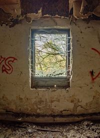 Abandoned window on wall