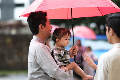 Close-up of father holding son