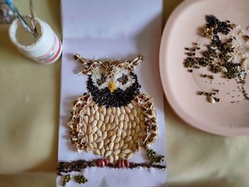 High angle view of bee on plate
