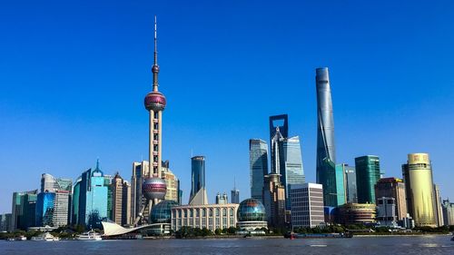 View of skyscrapers against blue sky