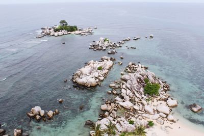 High angle view of rocks in sea