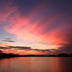 Scenic view of sea against romantic sky at sunset