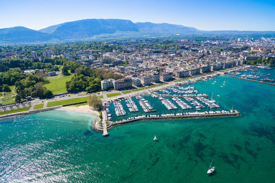 High angle view of city by sea