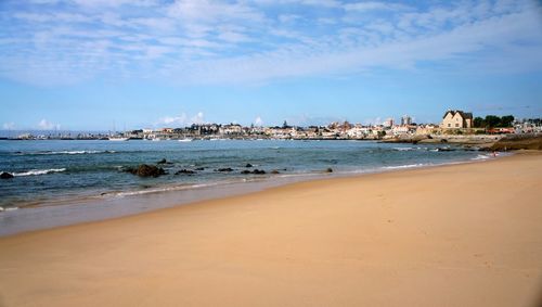 Scenic view of sea against cloudy sky