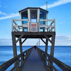 Pier over sea against sky