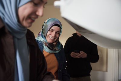 Family cooking together for eid al-fitr in kitchen