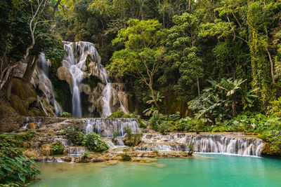 Kuang si or kunag xi waterfalls close to luang prabang in laos