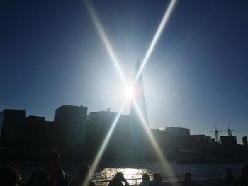 Sun shining through city