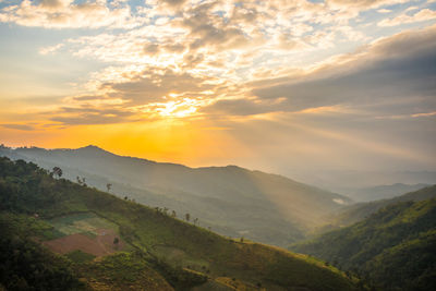 Scenic view of landscape against sky during sunset