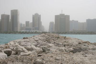 City by sea against sky