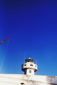 Low angle view of building against clear blue sky