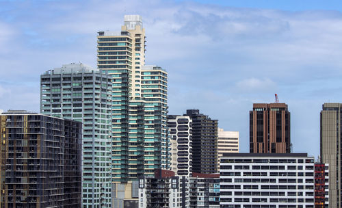 Modern buildings in city against sky