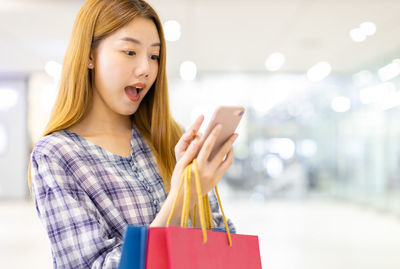 Woman holding a baby in a hand