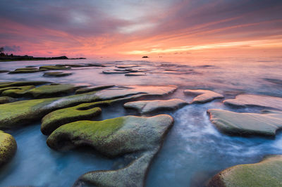 Scenic view of sea against sky during sunset