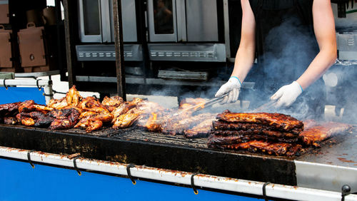 Barbecue ribs and chicken on the grill at a summer festival