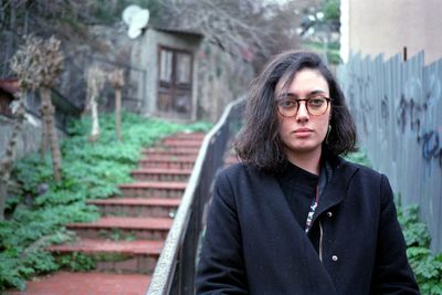 Portrait of woman standing outdoors