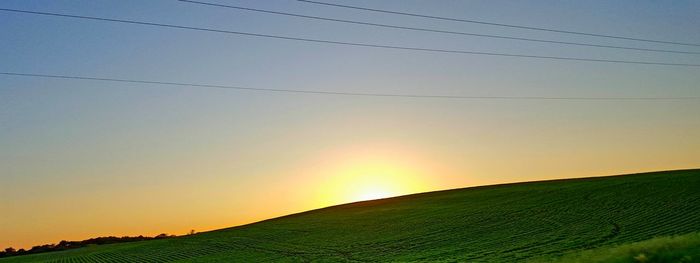 Scenic view of landscape at sunset