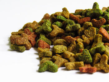 High angle view of food in plate against white background