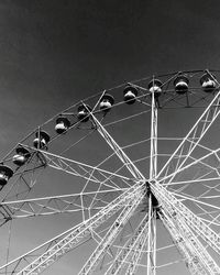 Low angle view of ferris wheel against sky at night