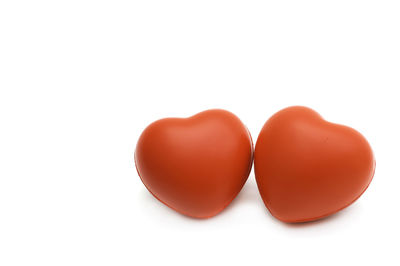 Close-up of tomatoes over white background