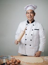 Portrait of smiling male chef preparing food
