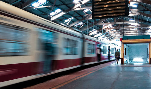 Blurred motion of train at railroad station