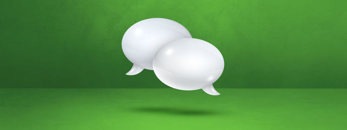Close-up of white balloon against gray background