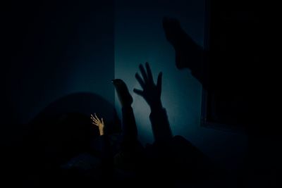 Woman standing at night