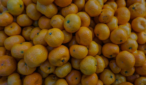 Full frame shot of oranges at market stall