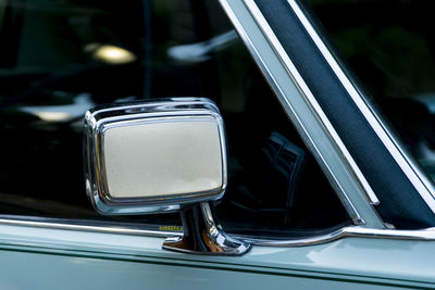 Close-up of vintage car on side-view mirror