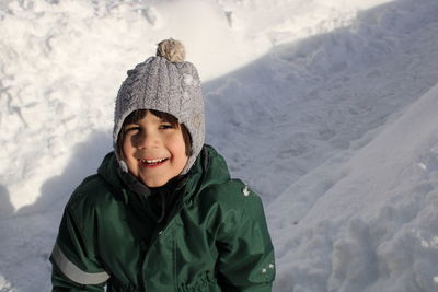 Portrait of boy playing in winter