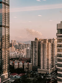 Buildings in city against sky