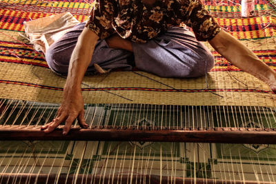 Low section of woman sitting on floor