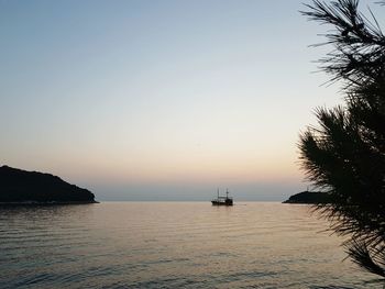 Scenic view of sea against clear sky during sunset